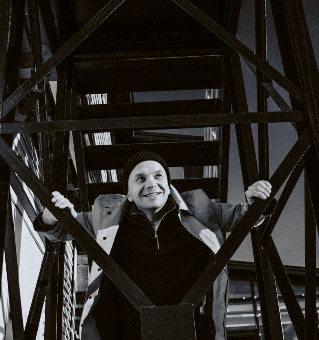 a man standing on top of a metal structure